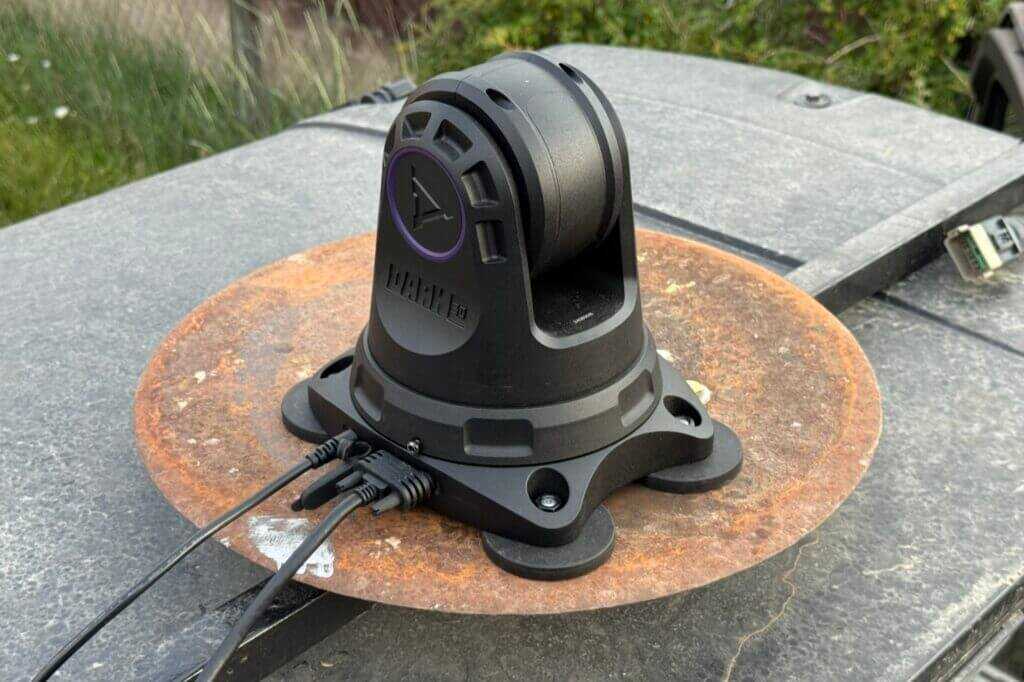 Power and HDMI ports on left side of Dark 30 Defiance PTZ base with cables routed into cab