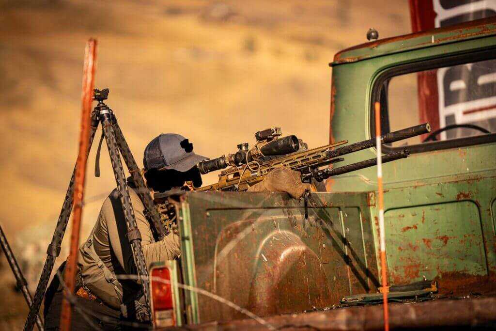 Active duty sniper shooting from truck with R3D carbon bipod legs installed on MDT CKYE-POD