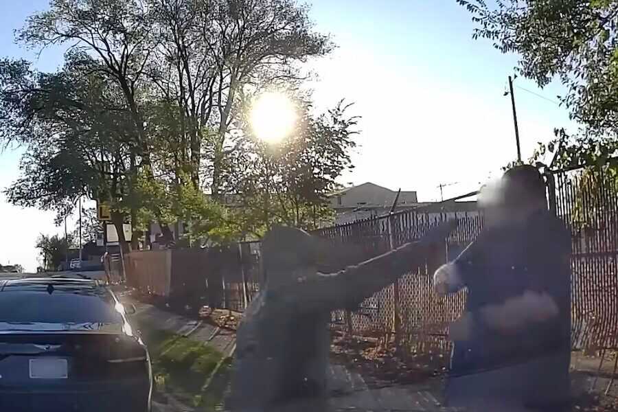 A screenshot of the suspect pistol-whipping the cop.