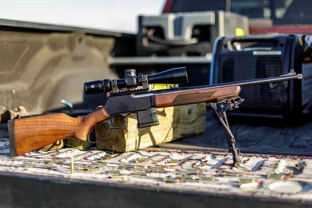 Full profile of Henry Lever Action Supreme on bipod showing free-floated barrel and threaded muzzle
