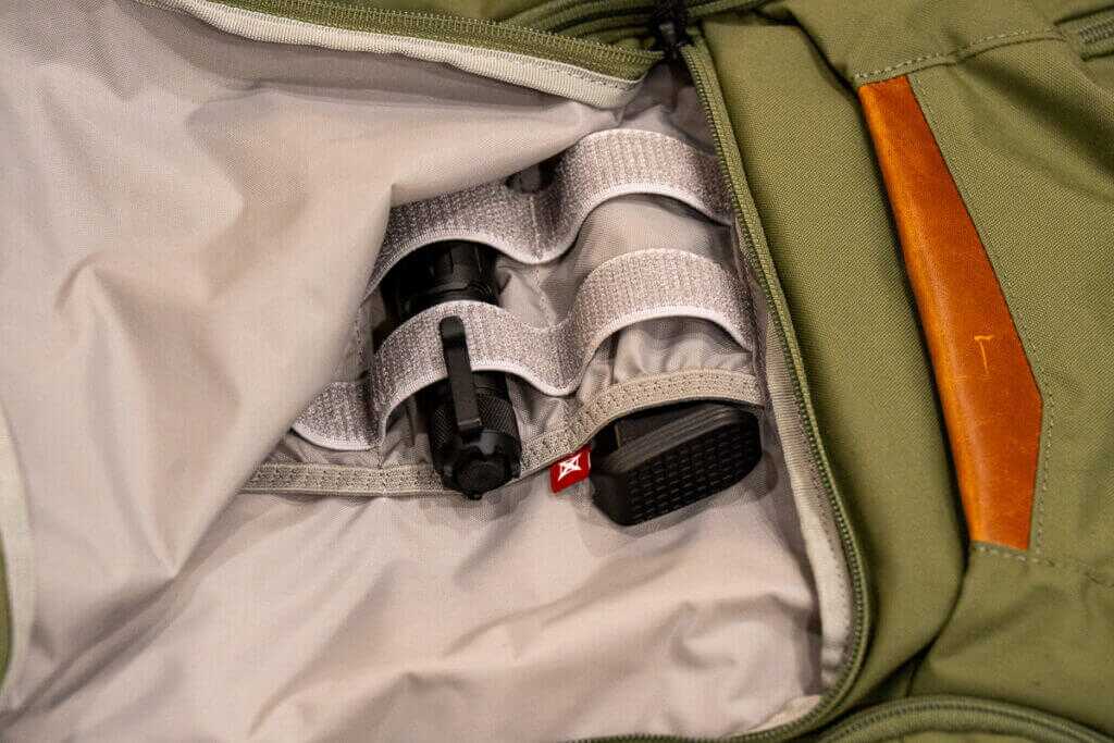 Vertx Gamut 32L interior organizer with mesh pockets, elastic loops, and slots