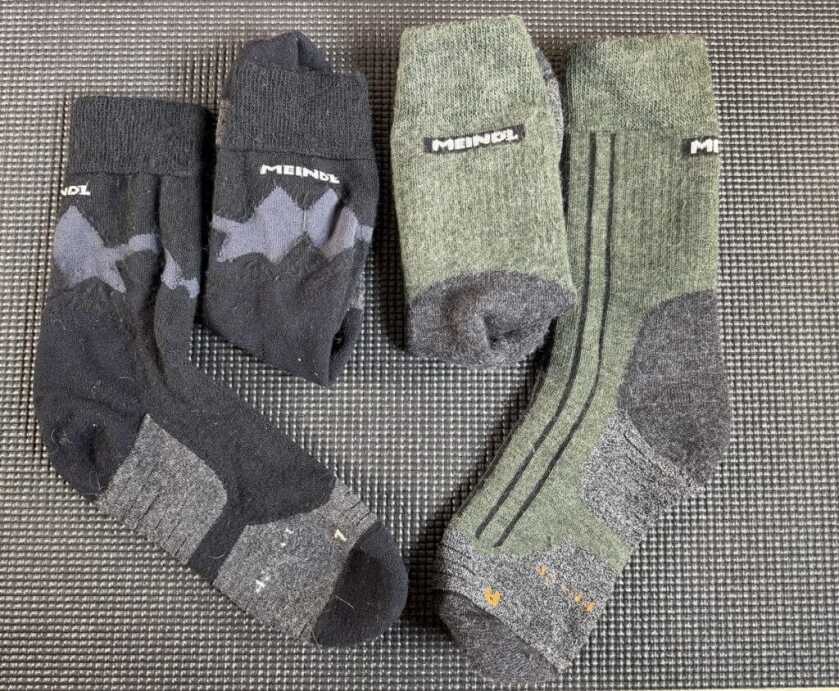 Meindl merino wool socks showing cushion panels ventilation and heel grip in light and midweight