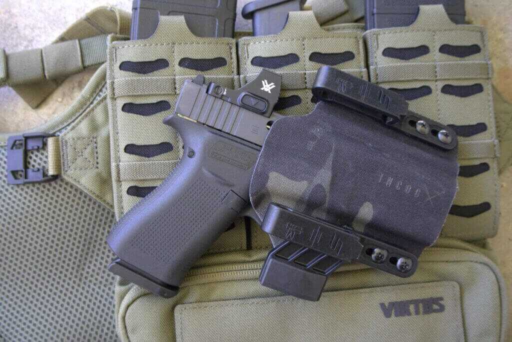 Safariland IncogX IWB holster carrying a Glock 48 on a green Vitkos chest rig, Cordura exterior shown