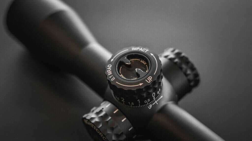 Close view of Nightforce FieldSet turret system showing zero reset and stop configuration