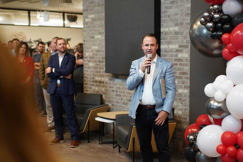 Brandon Maddox speaking into a microphone about suppressor policy and awareness