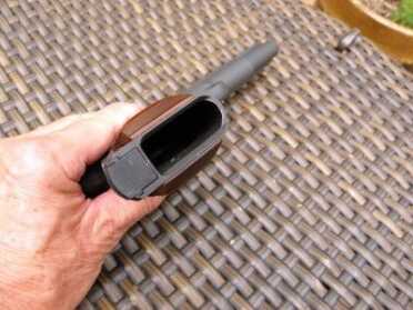 The mag well is not flared but the lips are beveled to facilitate reloading.