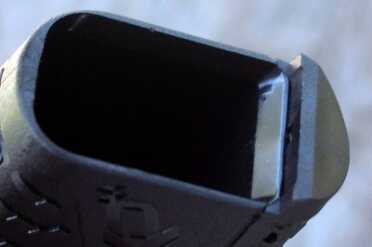 The mag well has modestly beveled edges, but is still easy enough to load on the fly.