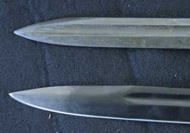 The 16" blade has the correct blood groove that went all the way to the tip on the cut down originals. 