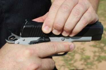 The Master Carry has serrations at the rear of the slide, but not the front.