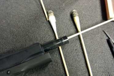 RamRodz--Gun Cleaning Made Even Easier Cleaning away. The handle is flexible enough to go in through the ejection port on a 1911 but this is easier.