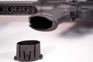 The grip offers a storage area. The bottom secures with a spring snap, but is easy to open using, you guessed it, a bullet tip.