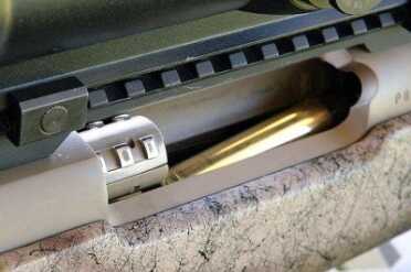 The Mark V is a push feed rifle. You can see the bolt picking up the top round from the magazine as it travels forward.