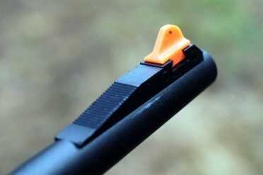 The Surprising Survival Rifle: Henry's AR-7--Review The front sight is wide, and orange (which makes it easy to see on the dark backdrop of the woods).