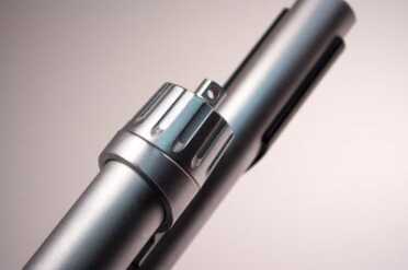 The matte chrome finish helps reduce glare and protect from the elements. Note the sling swivel on the front of the magazine tube.