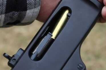 The round angles up during feeding, and the rim slide under the extractor. 