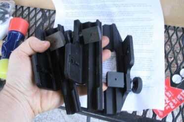 The AIM mount, the mount that came with the 10-50x scope, and the Springfield are mostly the same, except the Springfield has a split rail. 