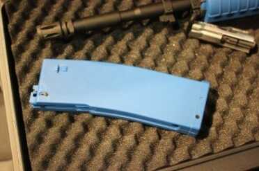 The blue magazines won't accept live ammo.