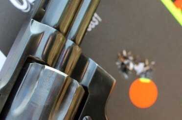 The Best Revolver Ever Made? Colt's Python--Review I jacked up the focus on this photo, but the clean hole is still visible behind the gun. That's six from 25 yards, double action.