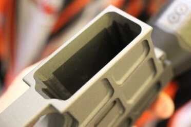 Rhino Arms--SHOT Show 2015 Look how the mag well is constructed. The exterior frame is cut to remove weight, but it still leaves a wide opening to funnel in mags.