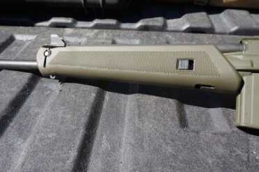 The forend pops open at the touch of a button.