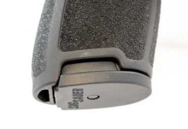 The grip has cutouts for manual magazine access if needed. 