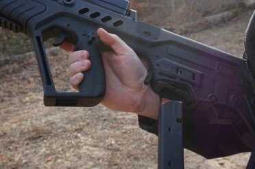 This lever here at the back of the hand drops the magazine (in this case, a 9mm mag--more on that in a moment).