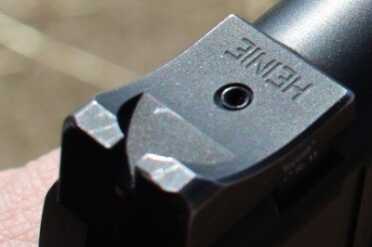 The Heine sight does have a slight ridge on its front edge that allows for one handed manipulation of the slide.