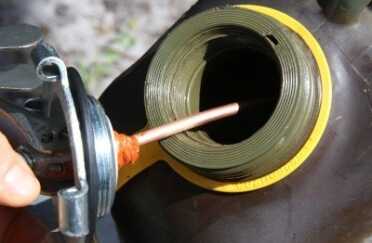 Prepping 101: Urban Survival Heater Stove Burns Oil/Gasoline 45k BTU The green can works as well as the red can but you have to be careful to get the threads right.