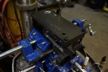 Drilling holes for the controls requires a bit more control. The angle of the holes is important, so I opted for the control offered by a drill press.