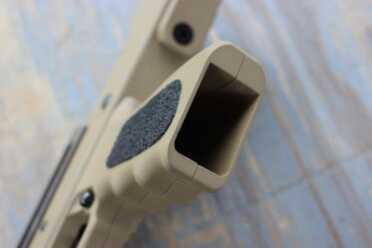 The grip. Despite the intentional design, it still feels rather squared off--much like a GLOCK.