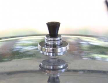 Then replace the weight, listen for the steam escaping, and hold it at temp for the required canning time. You do not have to maintain a ripping hard boil that makes the weight jingle. The directions say nothing about this. 