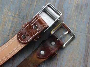 The buckle screws on with Chicago screws. No more rivets.