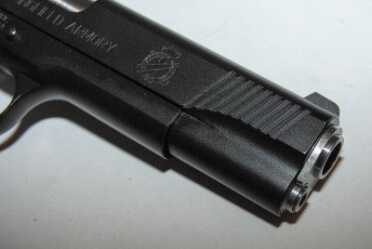 The slide has front and rear cocking serrations.