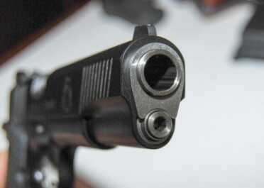 Looking at the business end, you'll see the end of a two-piece guide rod.