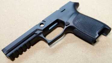 Grip frames are a replaceable commodity with the P320. This is the full size, medium grip. With five grooves of picatinny rail out front and E2 style texture, it provides a stable base for the gun.