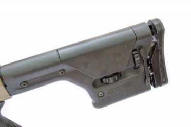 The horizontal dial on the stock raises the cheek piece.