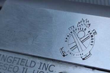 I've always been a fan of Springfield's use of the crossed canons, and it looks good on a 1911.