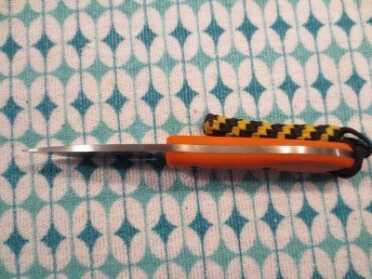 A spine shot of the Game Warden.  You can see the simple construction of the knife.  INFI steel with two slabs of G-10 attached at the sides.  I added the lanyard so it's easier to index while carrying.  