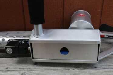 The battery compartment cover simply slips into the cavity and is held by gravity.