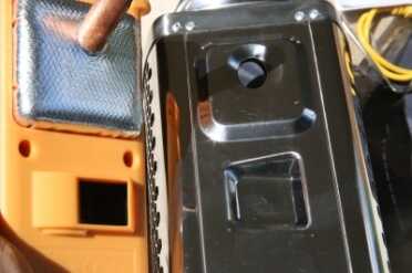 The charging/fan unit comes off the stove, and you can see the way it works. That copper rod is connected to the TEG pad, which is sealed onto the back of the plastic assembly. 