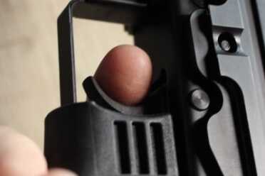 push forward and you the trigger pulls on the finger (which here is not resting on the shelf like it should be).