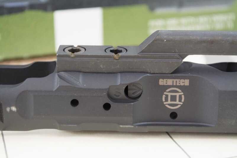 On the opposite side a flathead screw allows adjustment between suppressed and unsuppressed modes.