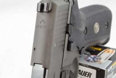 The Legion logo is engraved on the top of the slide just forward of the rear sight.