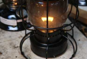 The fuel didn't last as long, 15 hours, and the glass got dirtier, but used a couple hours a night with periodic cleanings, I think the railroad lantern is a great option for a kids bedroom in a SHTF situation because of the added cage. It is also a great reading lamp. 