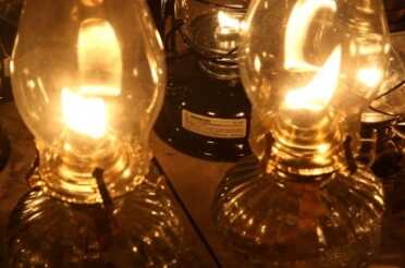 Even when you trim the wicks perfectly square, most tend to lean to one side, which creates a smoke trail at full blast. You can turn them down and minimize this. 