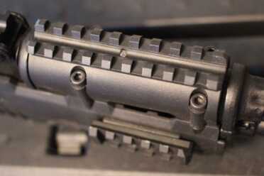 Troy Takes on the AK-47 The benefit is clear. My old rail was plastic, which is much less stable than the aluminum.