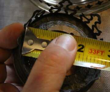 The chimney size is 2 5/8ths, and you can find chimneys in bulk on Ebay for as little as $8 each. The nicer ones are like $13. 