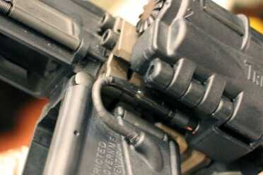 The cable bends easily, and won't crimp when you open the gun up.