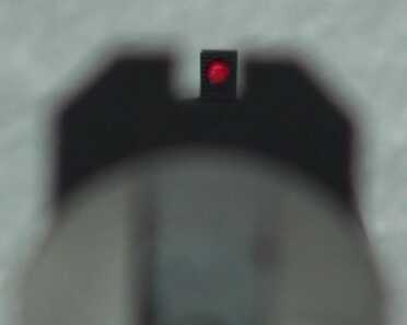 The red glow of the front bead.