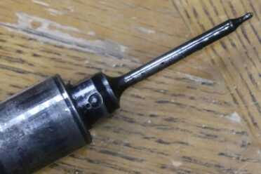 Front of tube used to in blowback operated bolt/recoil system holding firing pin.